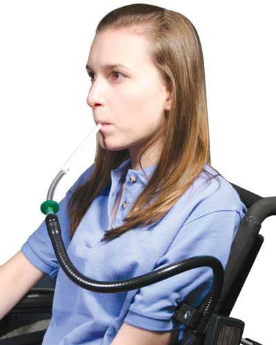 Young woman using 19" Gooseneck Sip and puff Switch mounted on a wheelchair