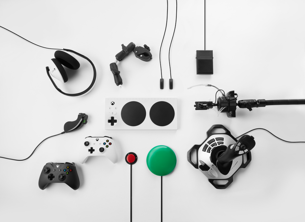 Microsoft's Adaptive Controller product shot with Xbox controllers and adaptive switches